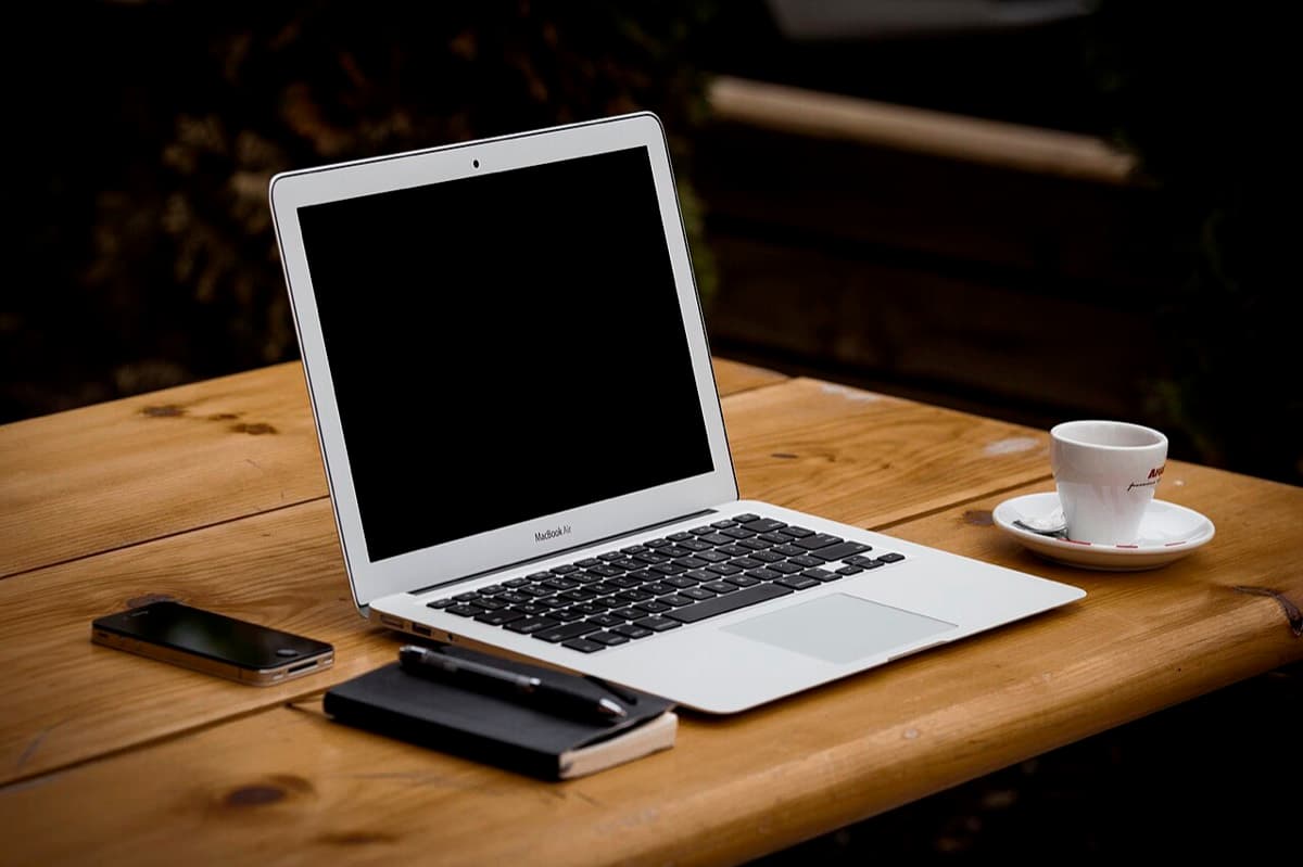 A laptop on a wooden table